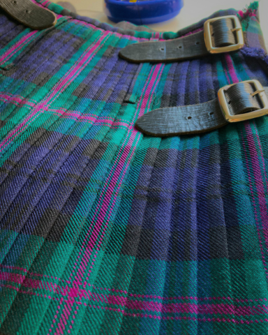 Kilt after alteration, steaming, pressing, pleat adjustment, and re - stitching