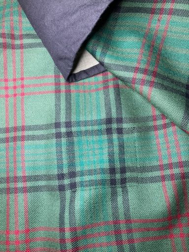 Completed invisible mending on kilt tartan after repair
