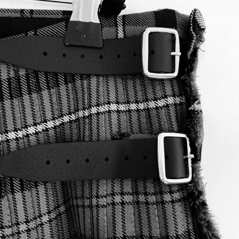 Replaced lather kilt straps and metal buckles on tartan fabric - Glasgow kilt repair service 