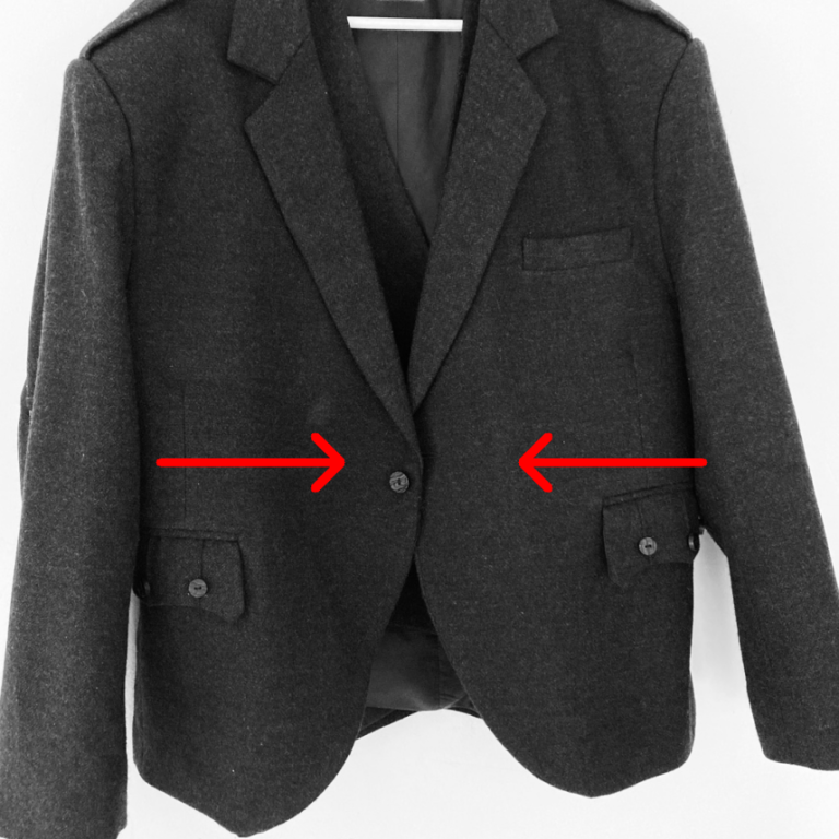 Grey jacket with arrows indicating resizing - Glasgow jacket alteration and tailoring service
